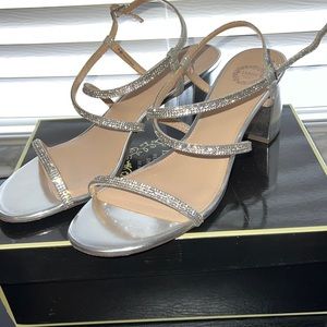 Beautiful shiny discreet silver sandals. Worn once. Size 10.